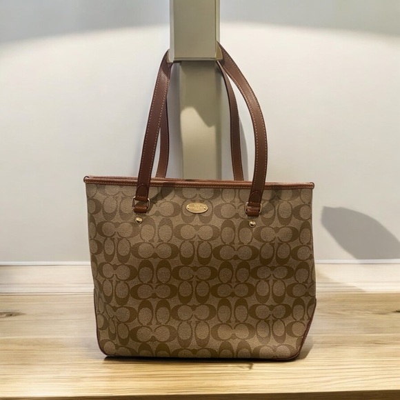 Coach Handbags - Coach beige & brown coated canvas & leather signature zip top  city tote F34603